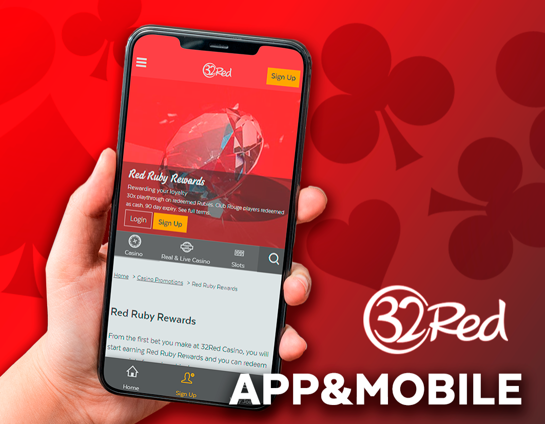 the hand holds the smartphone on which the 32Red casino website is open