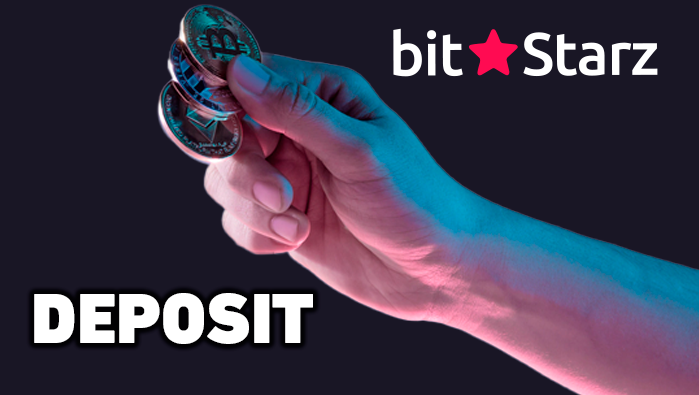 Hand holding Bitcoins and BitStarz logo